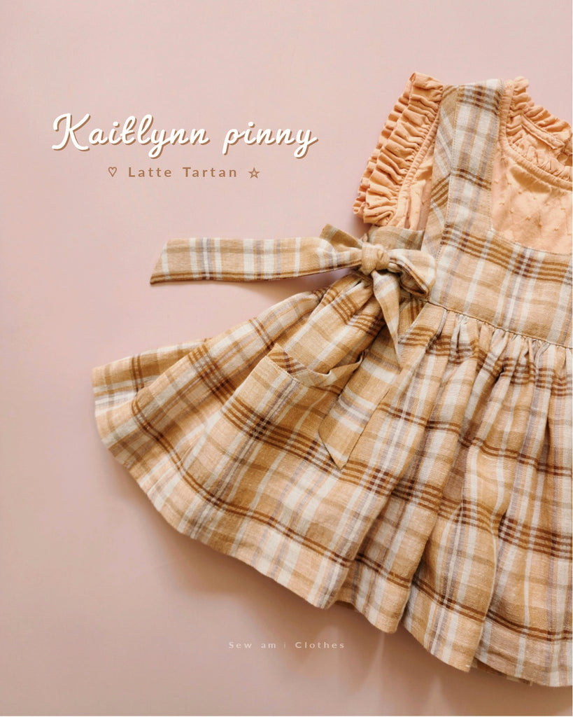 • Kaitlynn Pinny • Latte Tartan & Tail bow